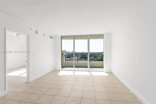 a view of an empty room and window