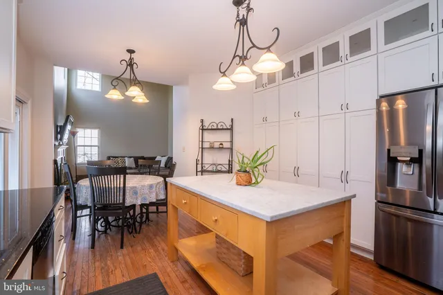 a view of an chairs and table in a room