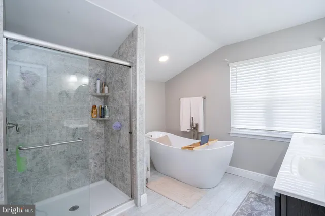 a bathroom with a sink and a window