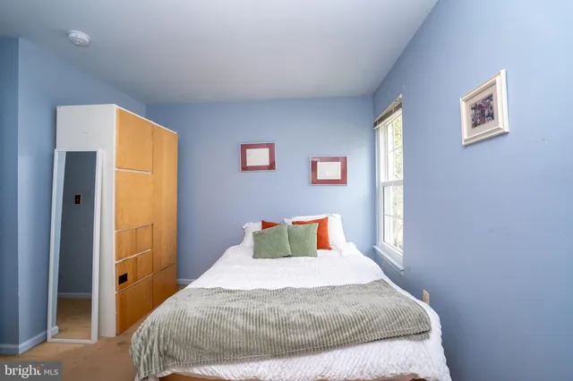 an aerial view of residential houses with yard