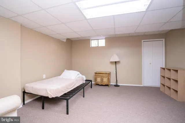an aerial view of residential houses with outdoor space and street view