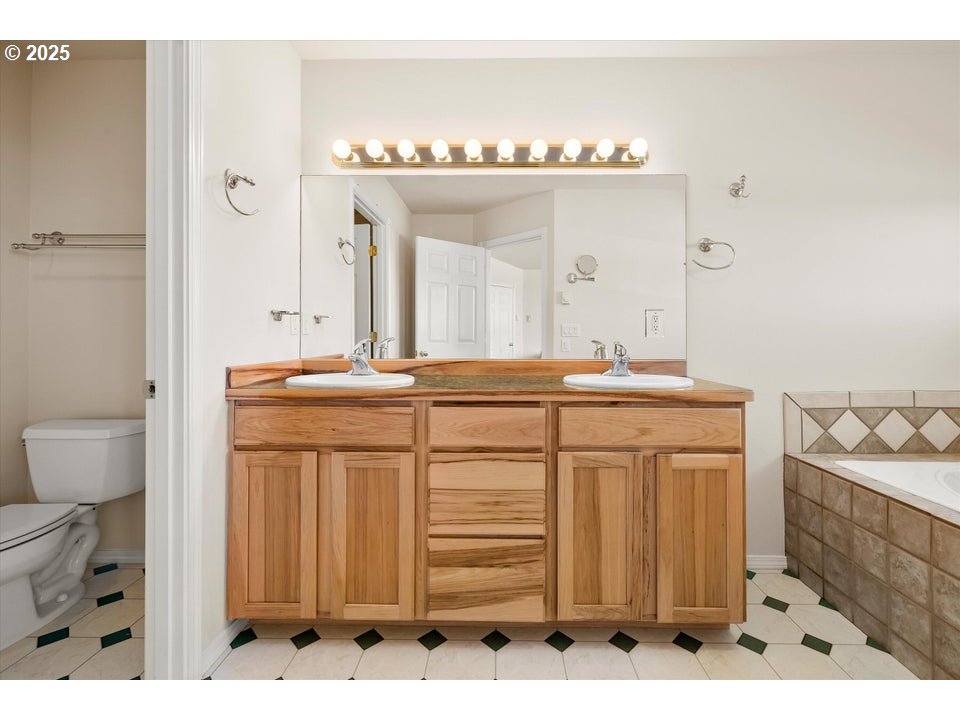 21085 Arid Avenue Bend, OR 97703 - Photo 18 of 45 a bathroom with a sink vanity and mirror