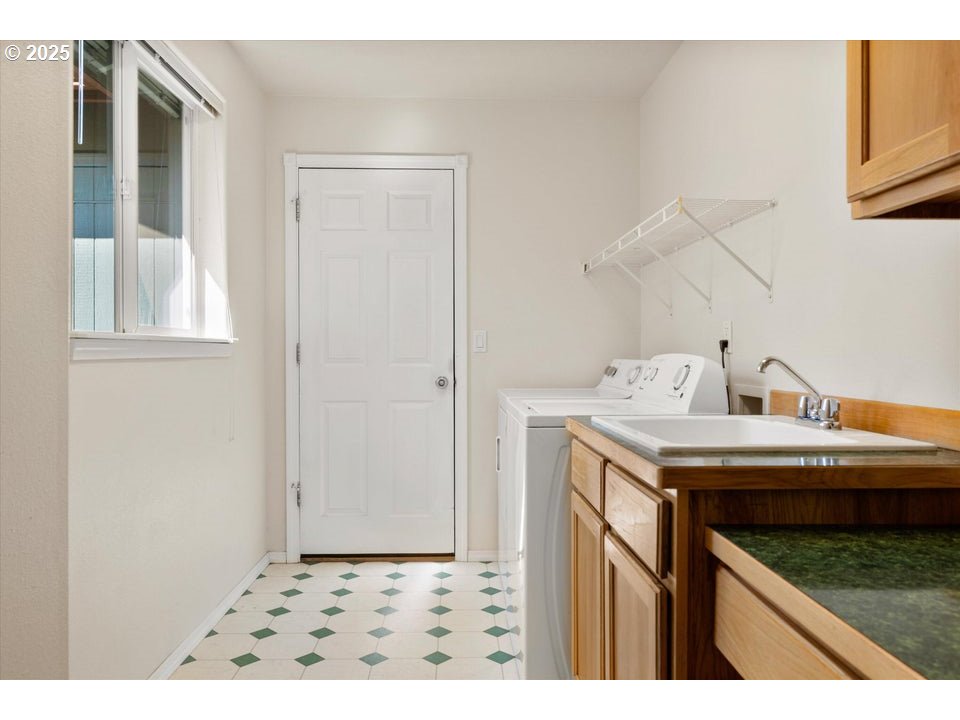 21085 Arid Avenue Bend, OR 97703 - Photo 20 of 45 a kitchen that has a sink and a stove