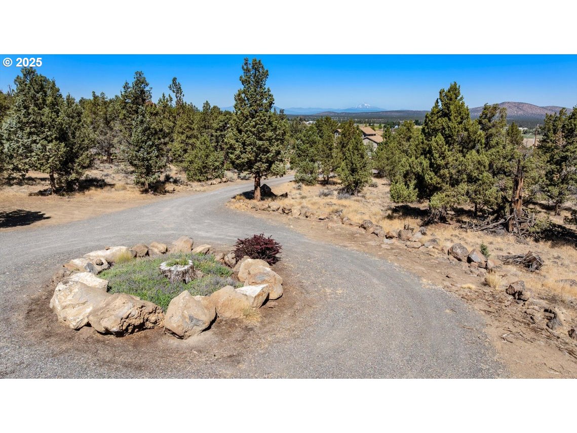 21085 Arid Avenue Bend, OR 97703 - Photo 2 of 45 a picture of a houses with a yard
