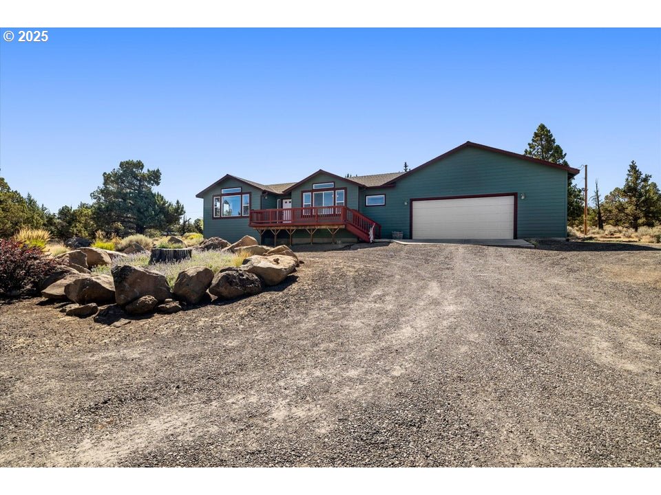 21085 Arid Avenue Bend, OR 97703 - Photo 33 of 45 a view of a house with a yard