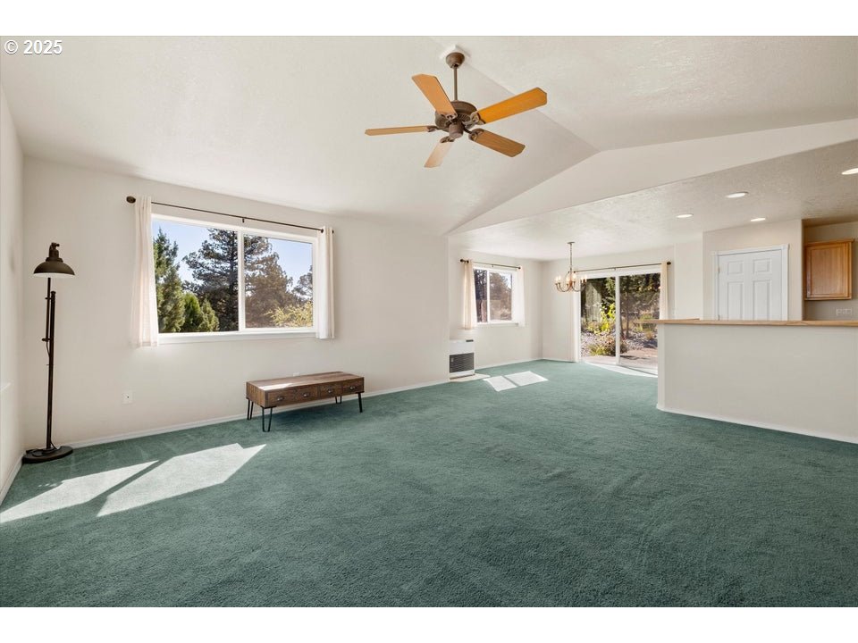 21085 Arid Avenue Bend, OR 97703 - Photo 5 of 45 a view of a livingroom with a ceiling fan and window