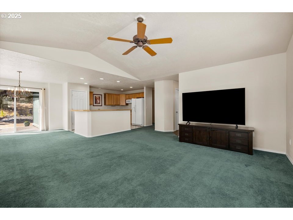 21085 Arid Avenue Bend, OR 97703 - Photo 7 of 45 a living room with furniture and a flat screen tv