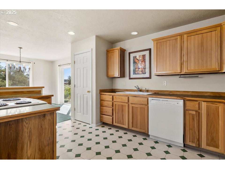 21085 Arid Avenue Bend, OR 97703 - Photo 8 of 45 a bathroom with a sink a vanity and a mirror