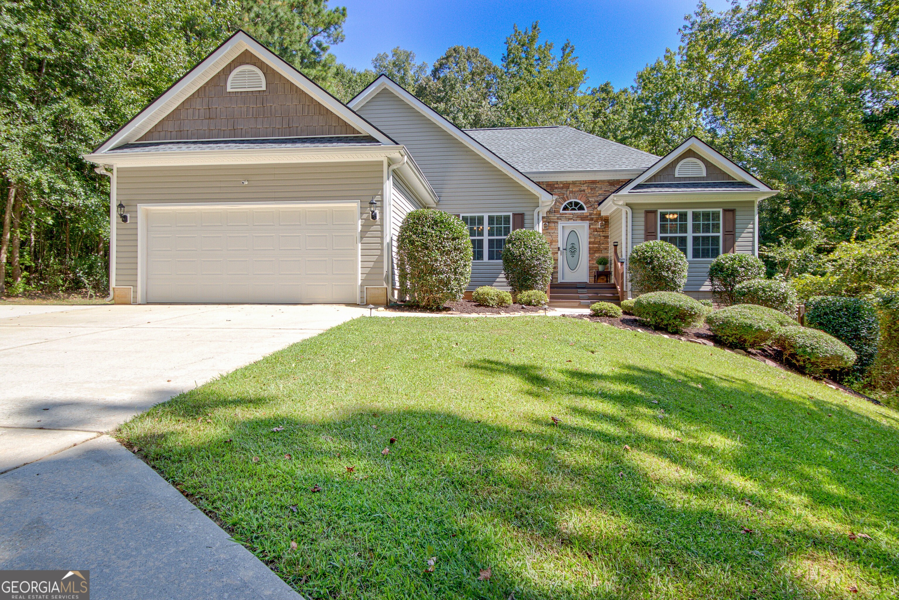 90 Rudders Crossing Newnan, GA 30263 - Photo 1 of 1 a front view of a house with a yard and garage
