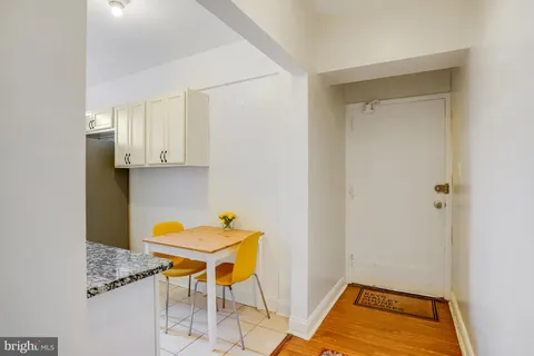 a room with a table and chairs
