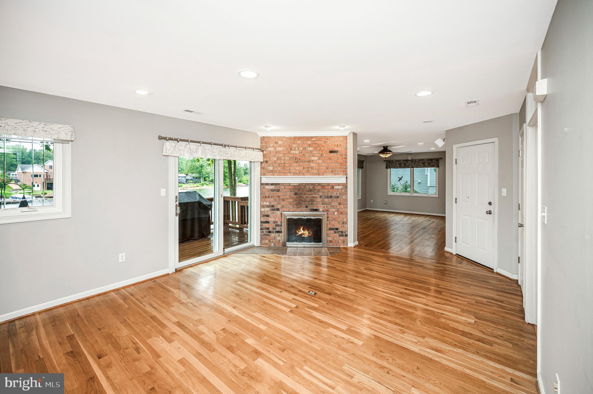 314 Birchside Circle Locust Grove, VA 22508 - Photo 11 of 59 Living room with fireplace and deck access