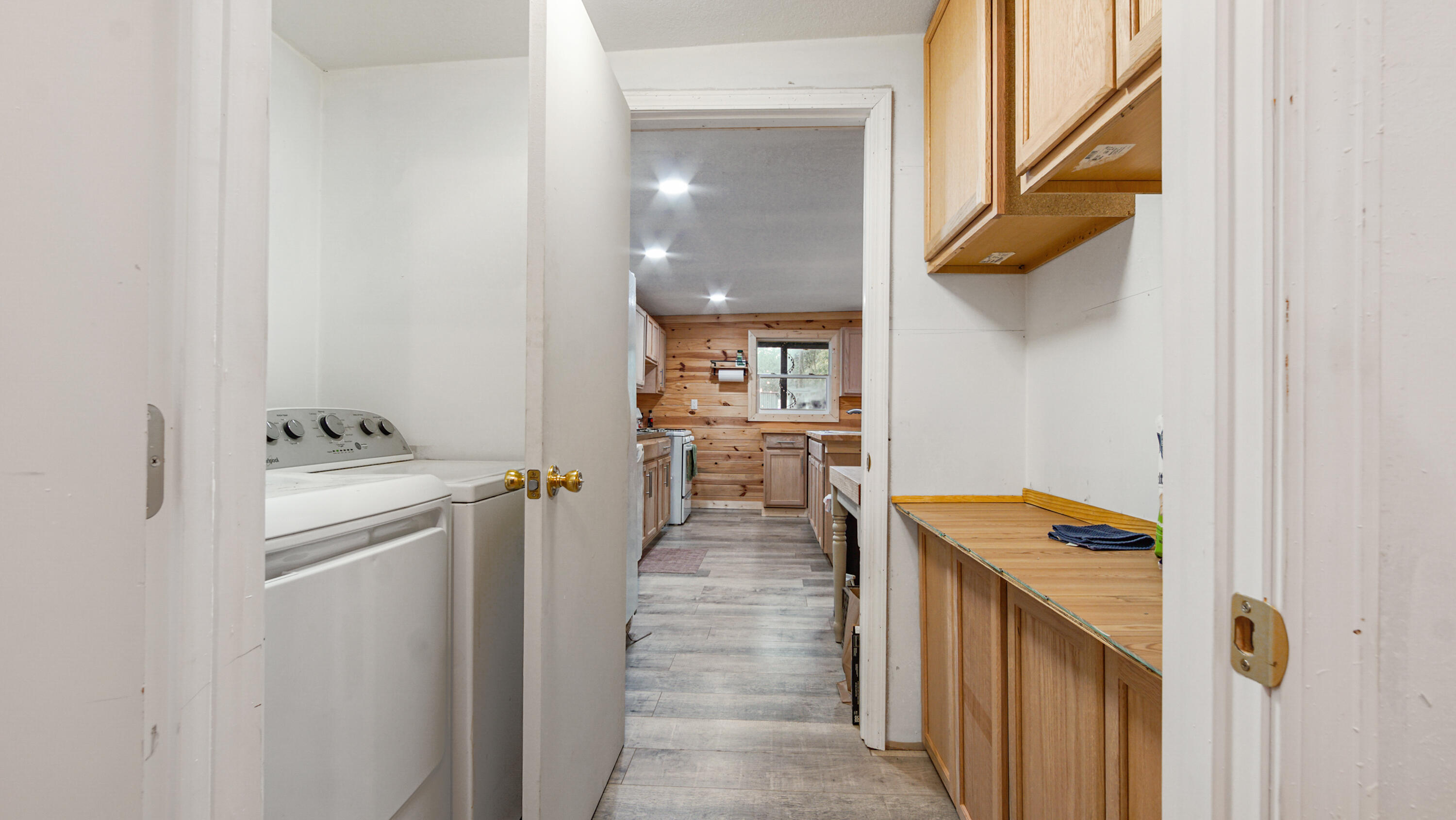70 River Loop Road Ponce de Leon, FL 32455 - Photo 13 of 50 a view of a hallway with wooden floor and a bathroom