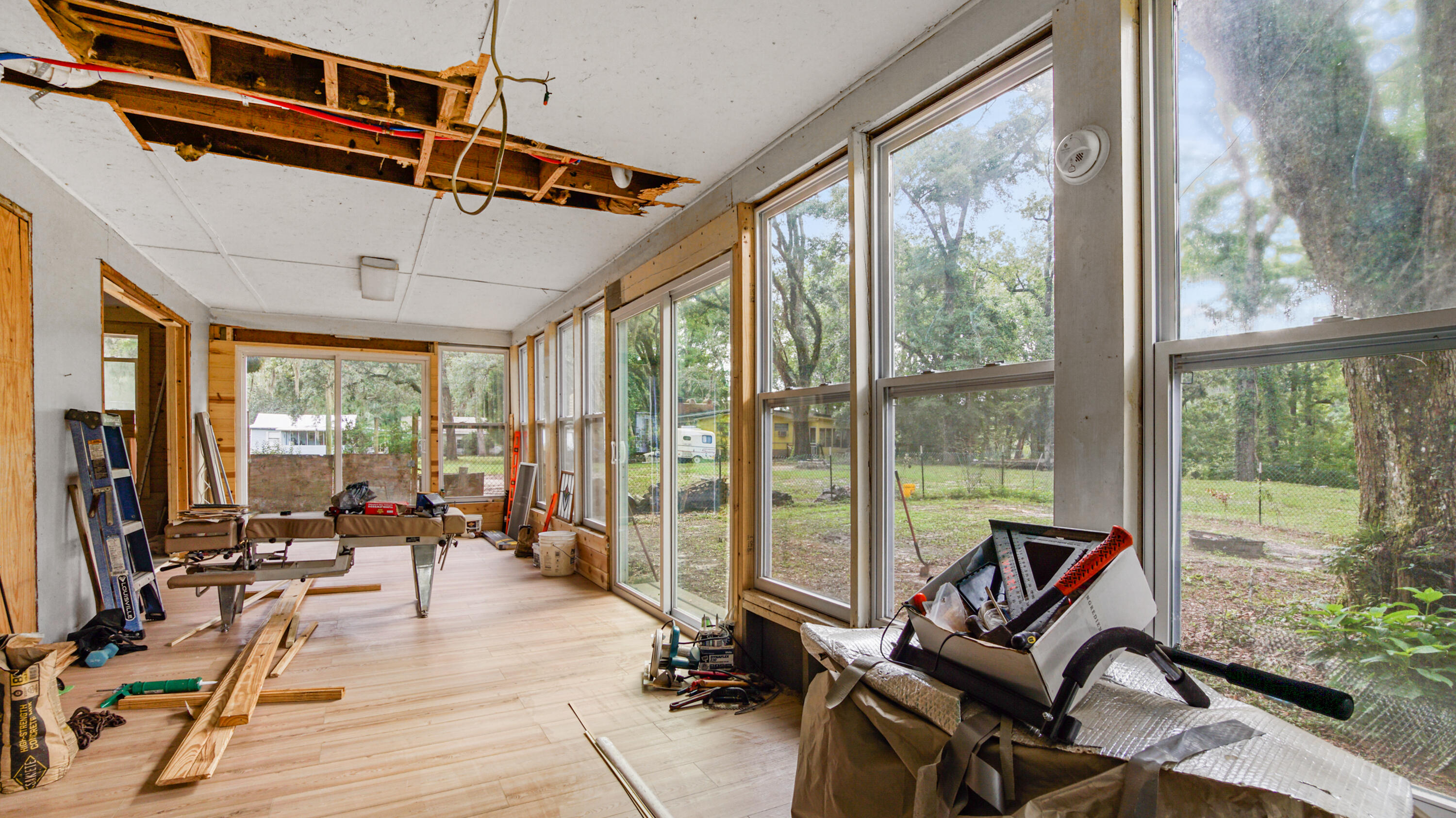 70 River Loop Road Ponce de Leon, FL 32455 - Photo 19 of 50 a view of a livingroom with furniture and floor to ceiling window