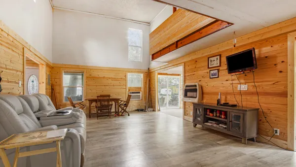 a bedroom with a bed and a dresser in it
