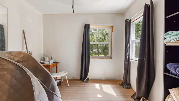 a view of a bedroom from a hallway