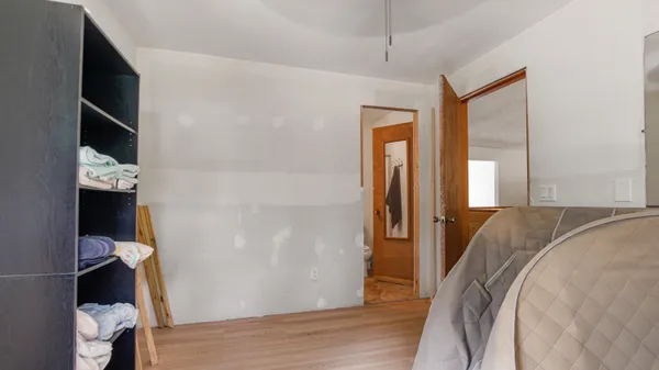 a bathroom with a sink vanity mirror and tub
