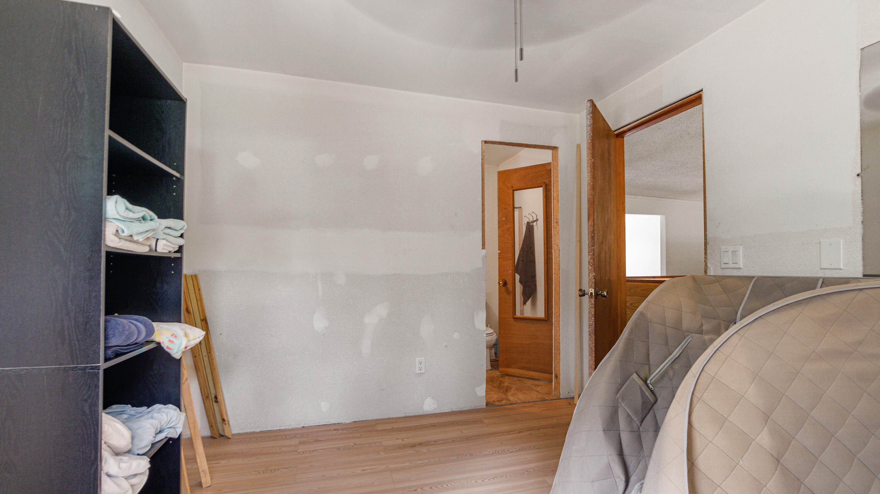 70 River Loop Road Ponce de Leon, FL 32455 - Photo 27 of 50 a bedroom with a bed and wooden floor
