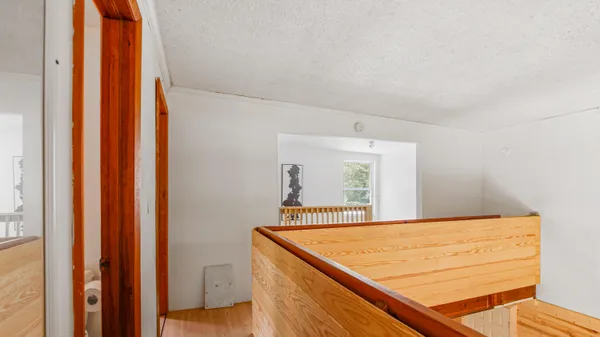 a view of a livingroom with furniture and a window