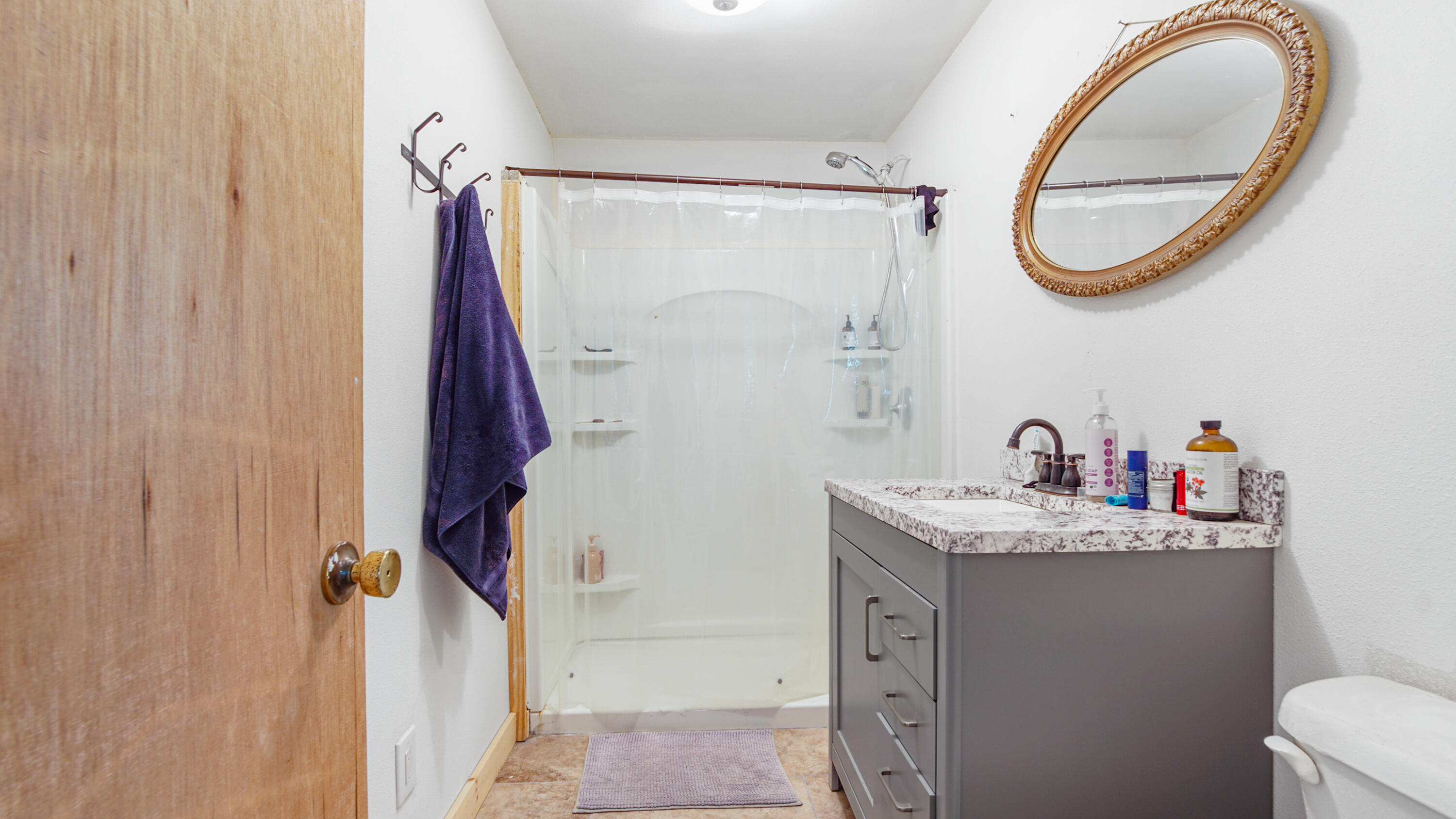 70 River Loop Road Ponce de Leon, FL 32455 - Photo 29 of 50 a bathroom with a sink vanity mirror and tub