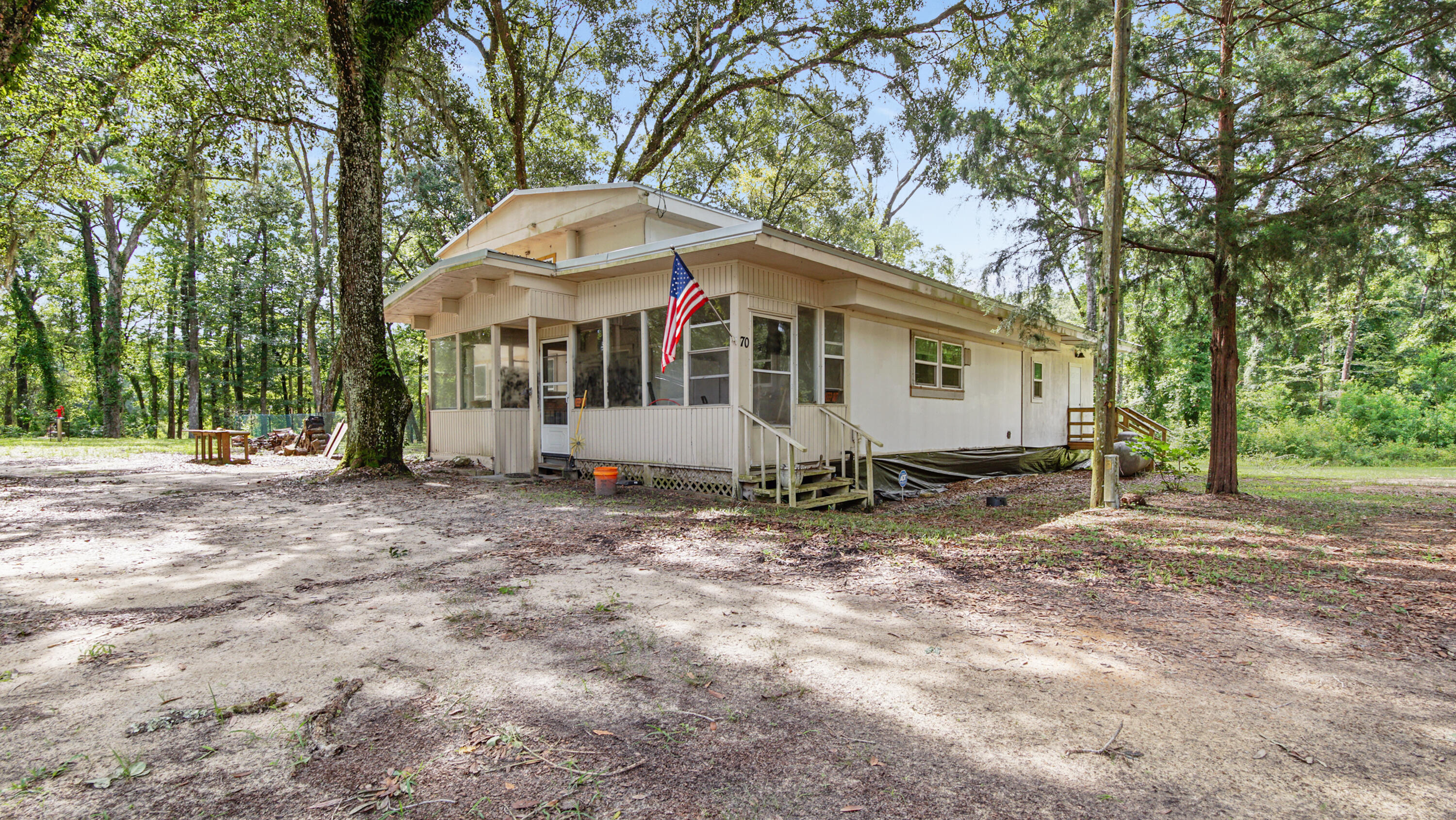 70 River Loop Road Ponce de Leon, FL 32455 - Photo 33 of 50 a front view of a house with a yard