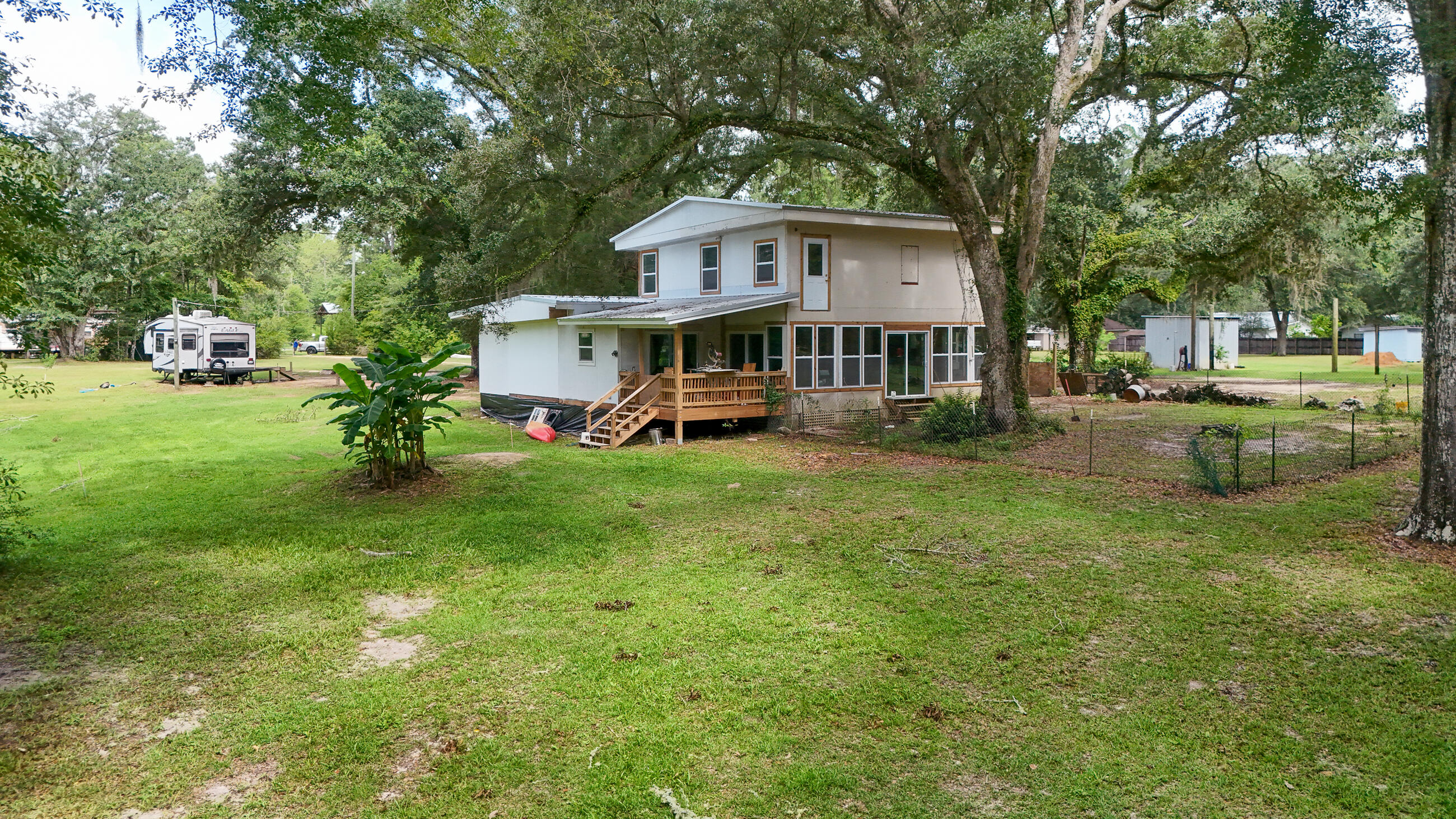 70 River Loop Road Ponce de Leon, FL 32455 - Photo 47 of 50 a front view of a house with a garden