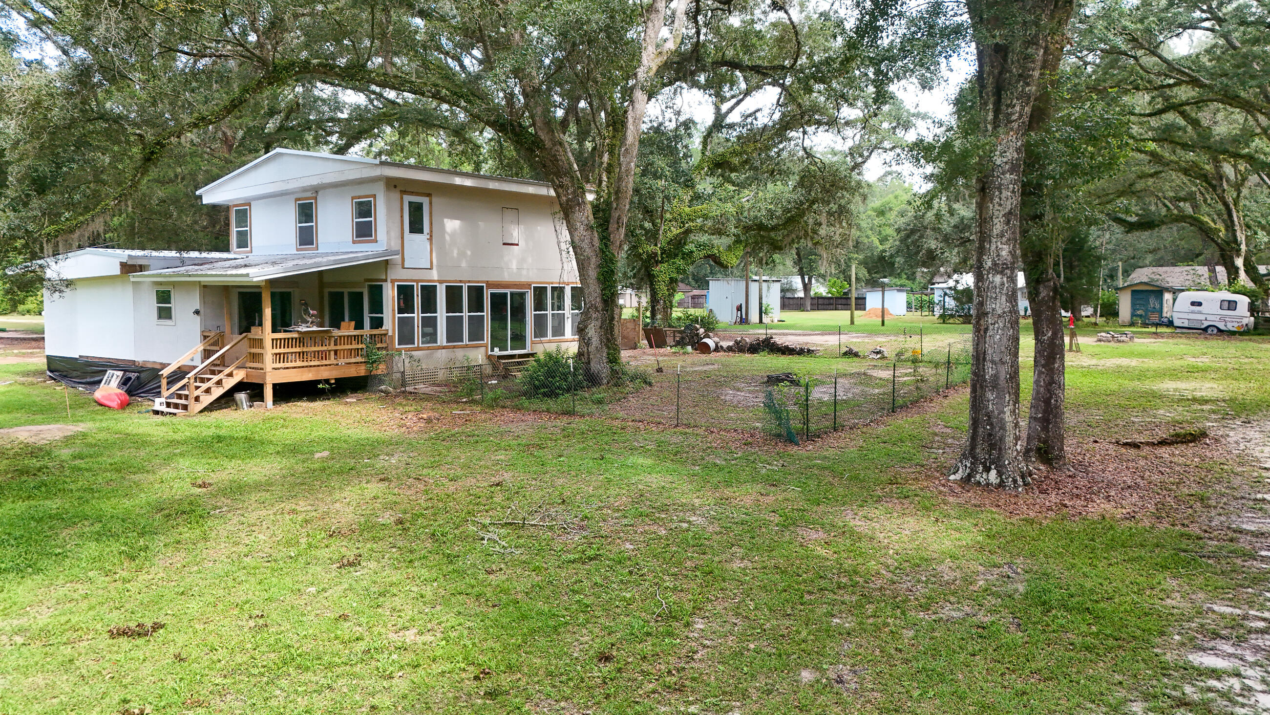 70 River Loop Road Ponce de Leon, FL 32455 - Photo 48 of 50 a front view of a house with garden