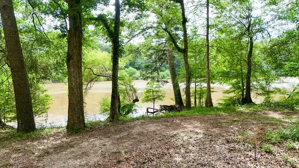 a kitchen with kitchen island granite countertop a sink and cabinets