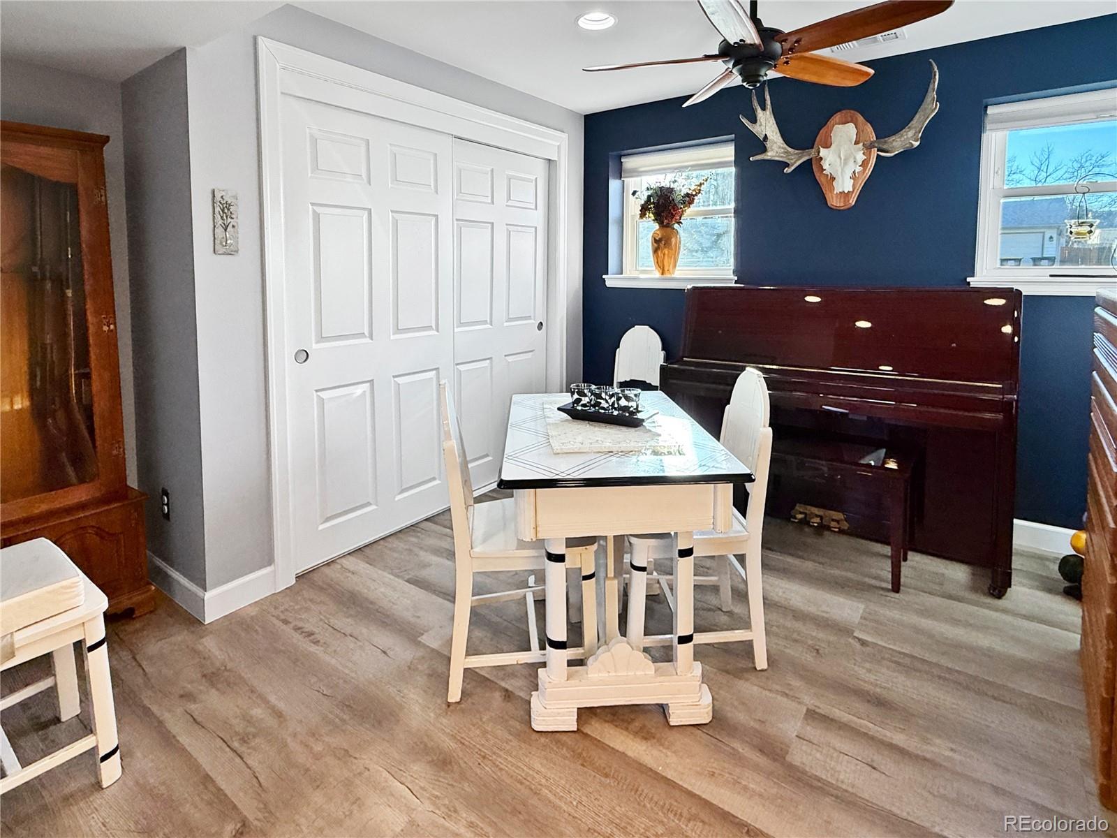 4386 South Xenophon Way Morrison, CO 80465 - Photo 16 of 38 a workspace with furniture and wooden floor