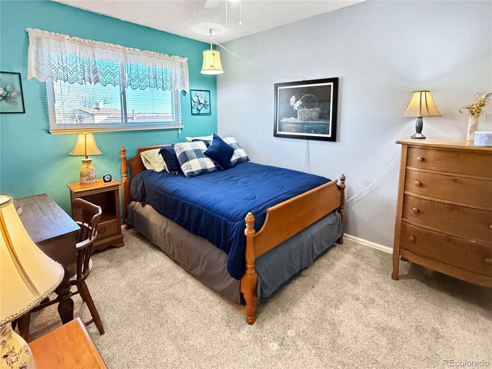 4386 South Xenophon Way Morrison, CO 80465 - Photo 23 of 38 a bed room with a bed and a window