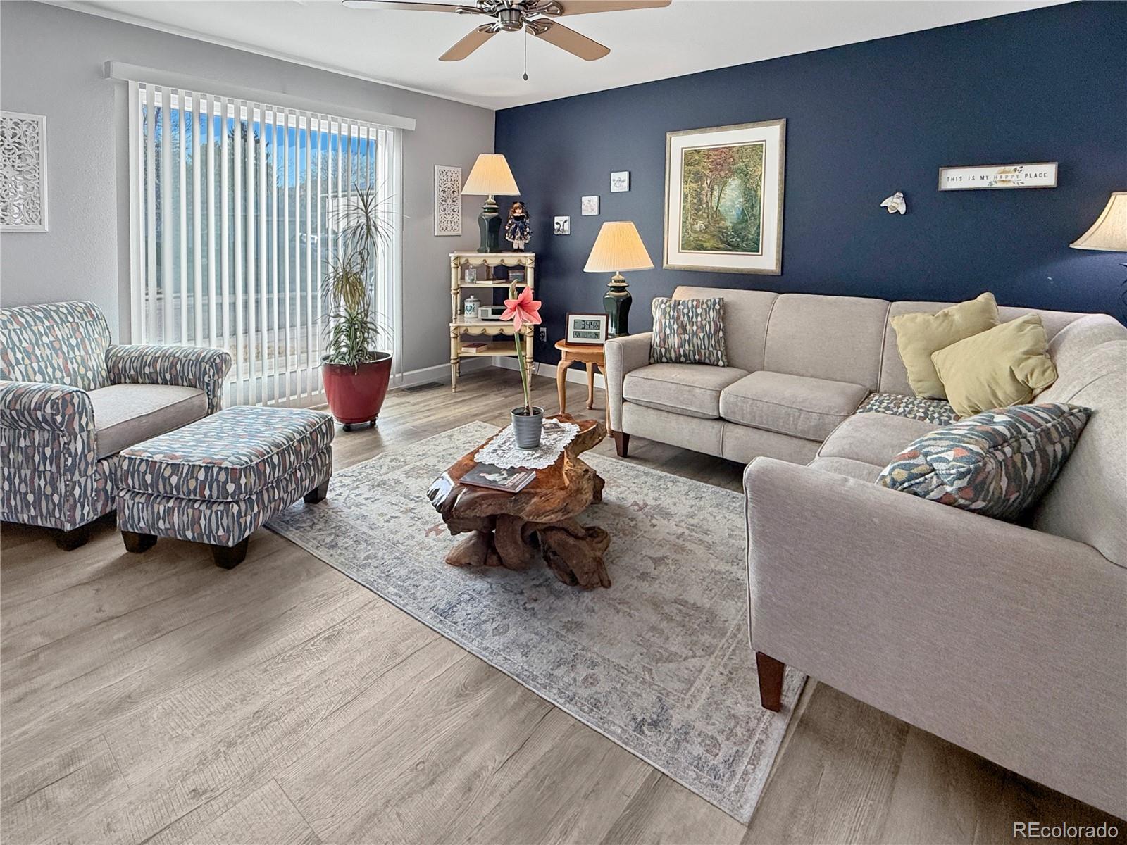 4386 South Xenophon Way Morrison, CO 80465 - Photo 3 of 38 a living room with furniture and a window