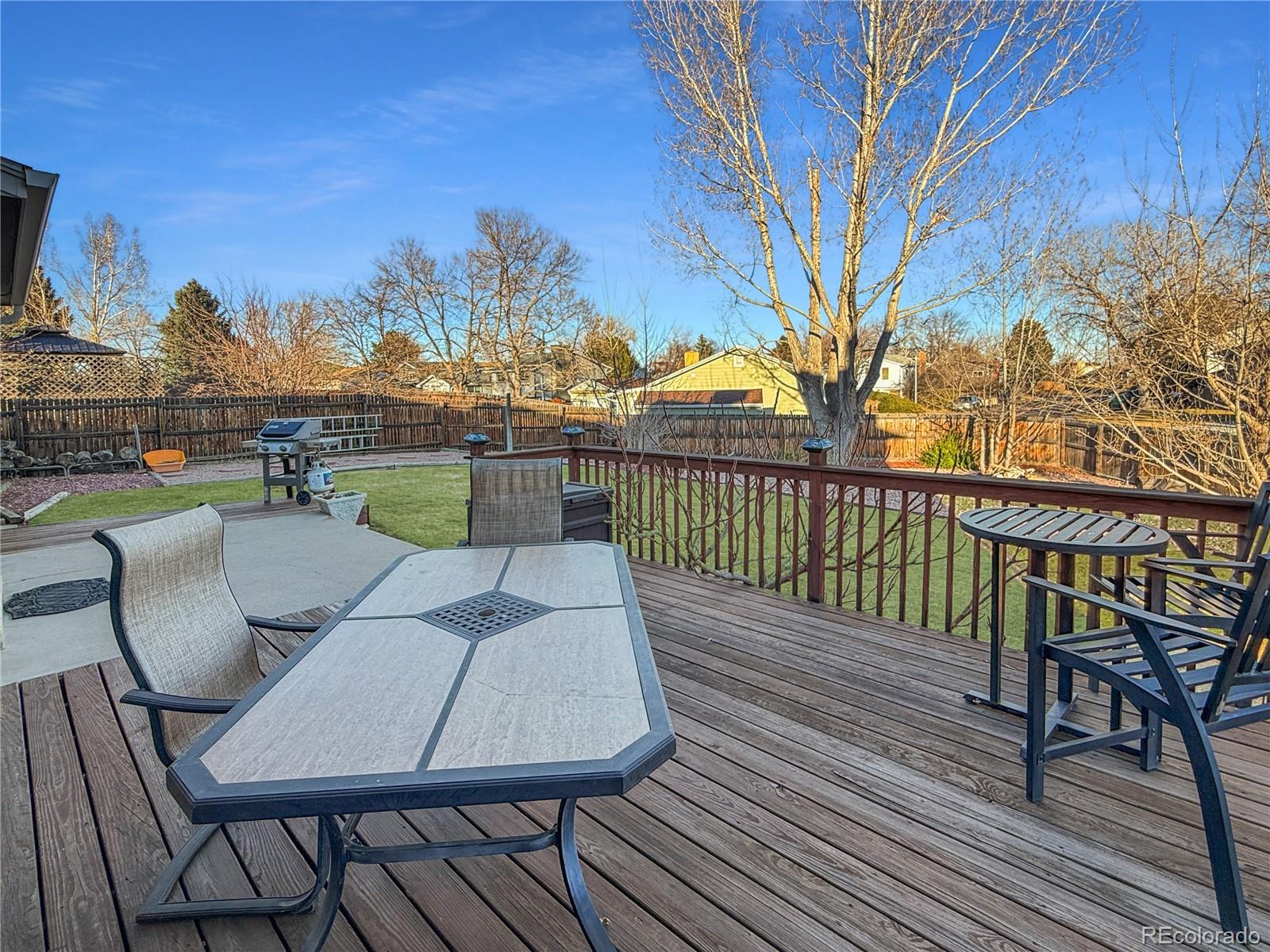 4386 South Xenophon Way Morrison, CO 80465 - Photo 31 of 38 a view of a chairs and table on the wooden floor