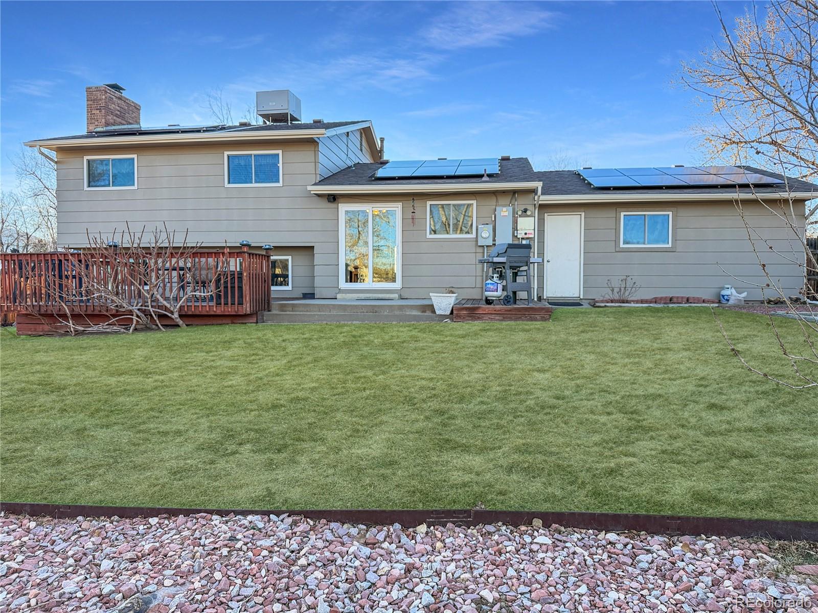 4386 South Xenophon Way Morrison, CO 80465 - Photo 32 of 38 a view of a house with a yard and sitting area