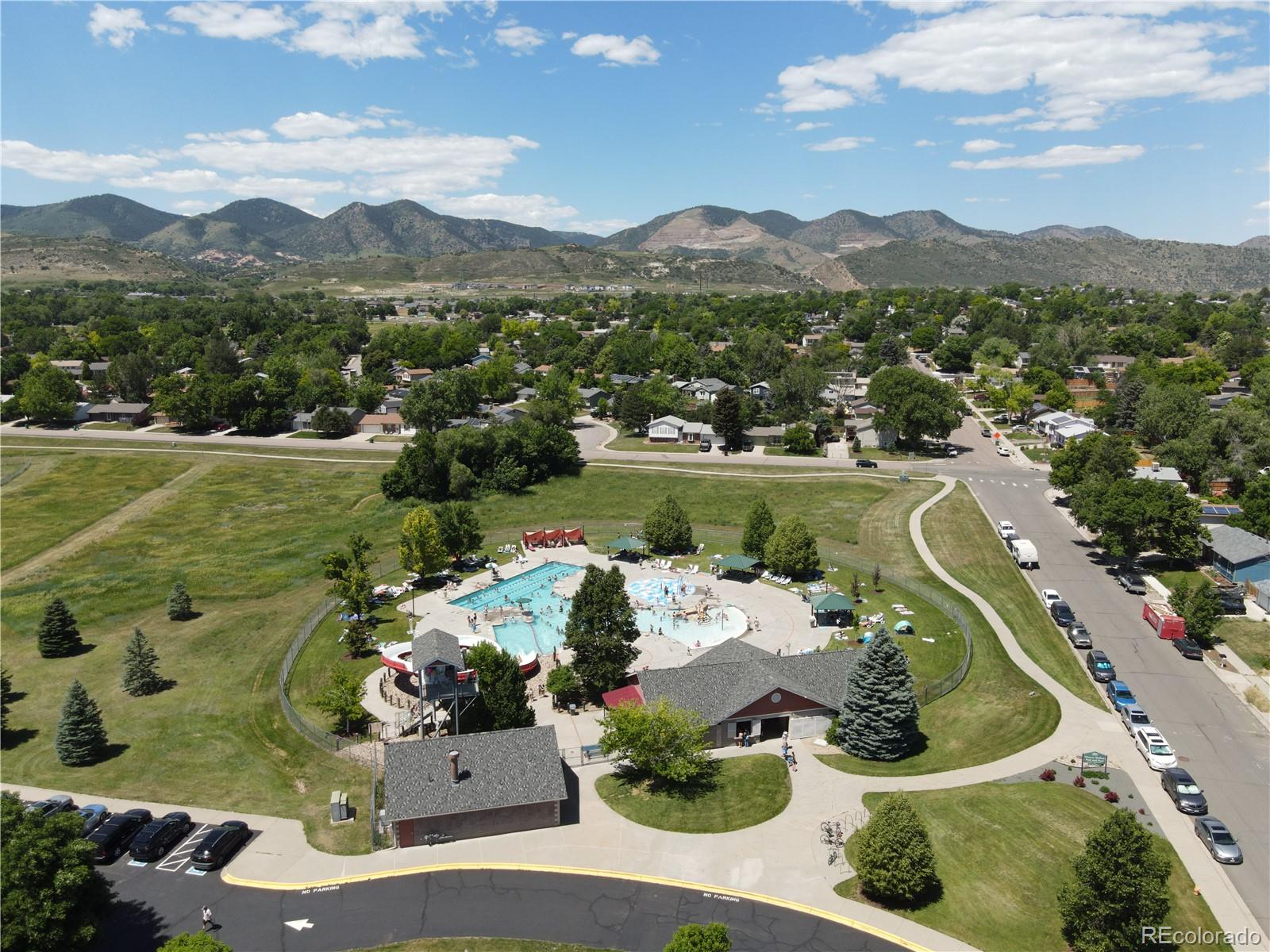 4386 South Xenophon Way Morrison, CO 80465 - Photo 37 of 38 a view of a house with a yard and a garden