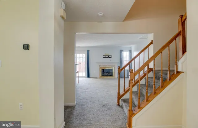 a view of entryway with wooden floor and stairs