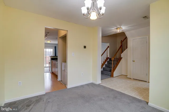 a view of a livingroom with a fireplace and window