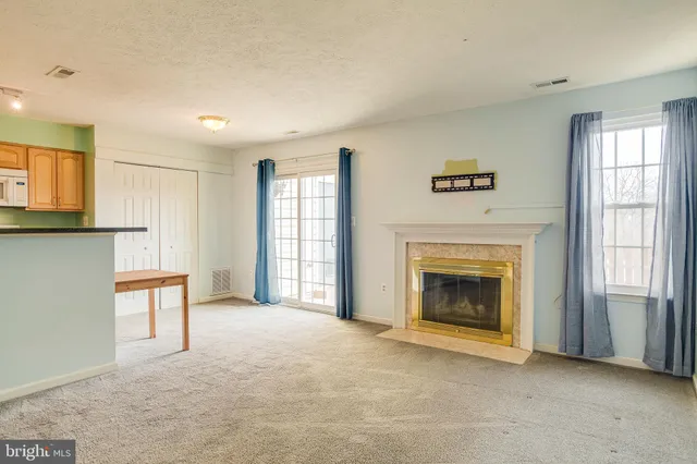 a view of a kitchen with furniture and a window