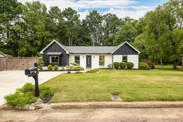 a swimming pool view with a seating space