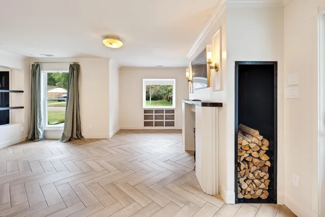 an empty room with windows and closet