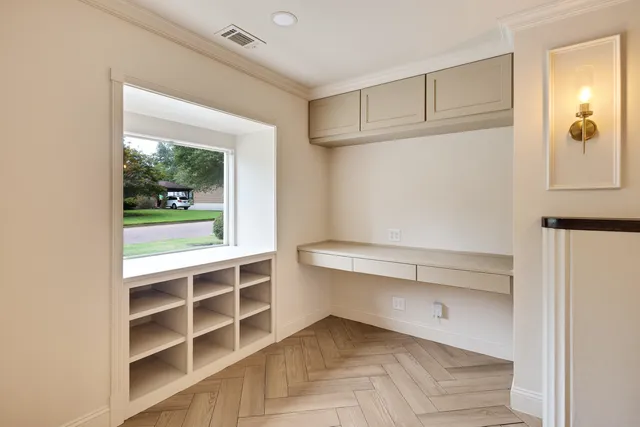a view of an empty room with a window