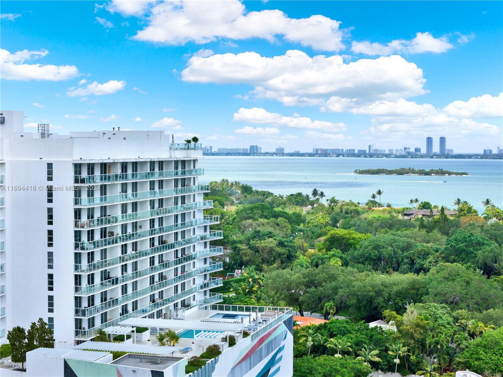 4250 Biscayne Boulevard, Unit 1607 Miami, FL 33137 - Photo 18 of 21 a view of a lake with a building in the background