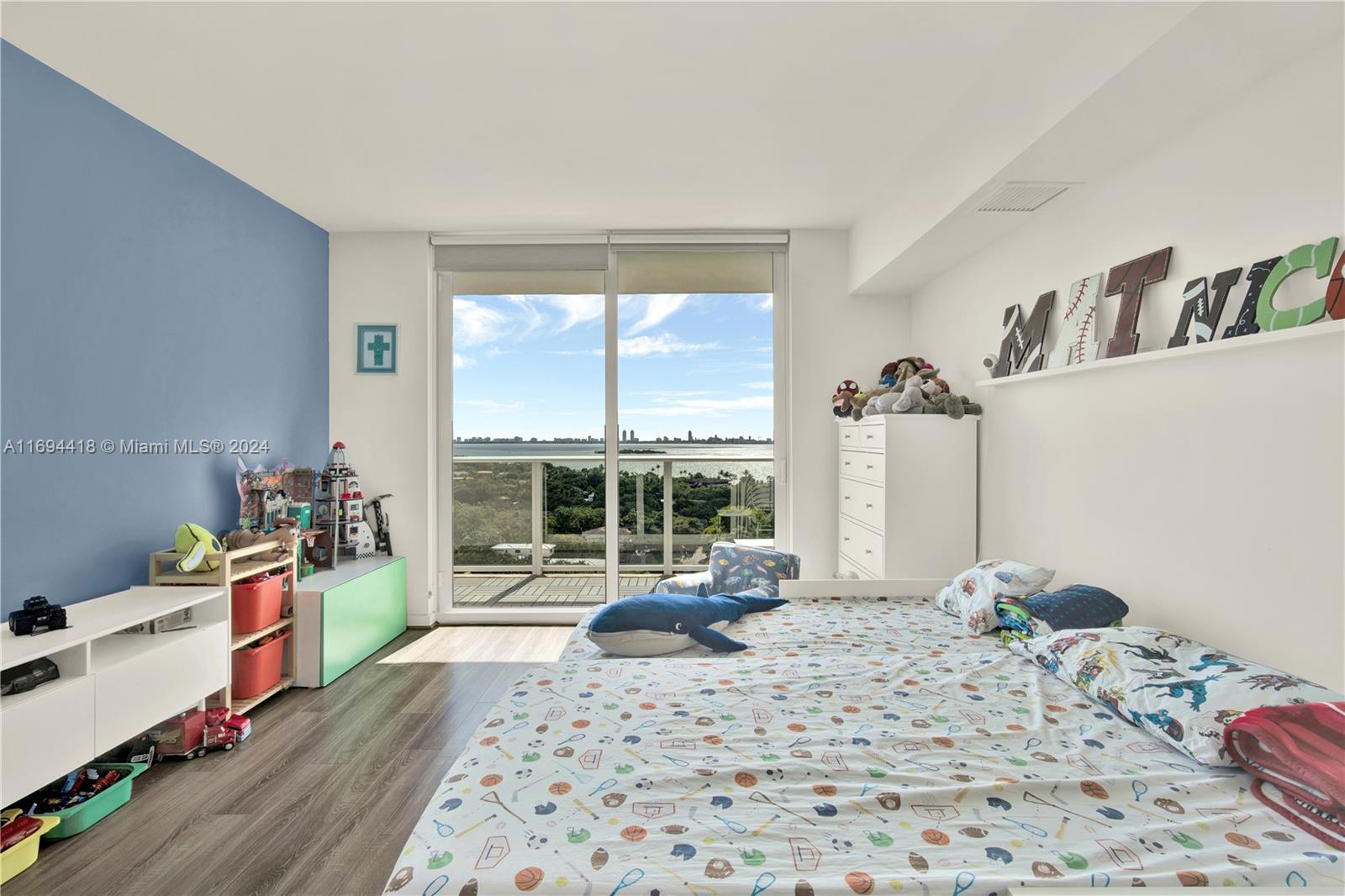 4250 Biscayne Boulevard, Unit 1607 Miami, FL 33137 - Photo 9 of 21 a bedroom with a bed and a window
