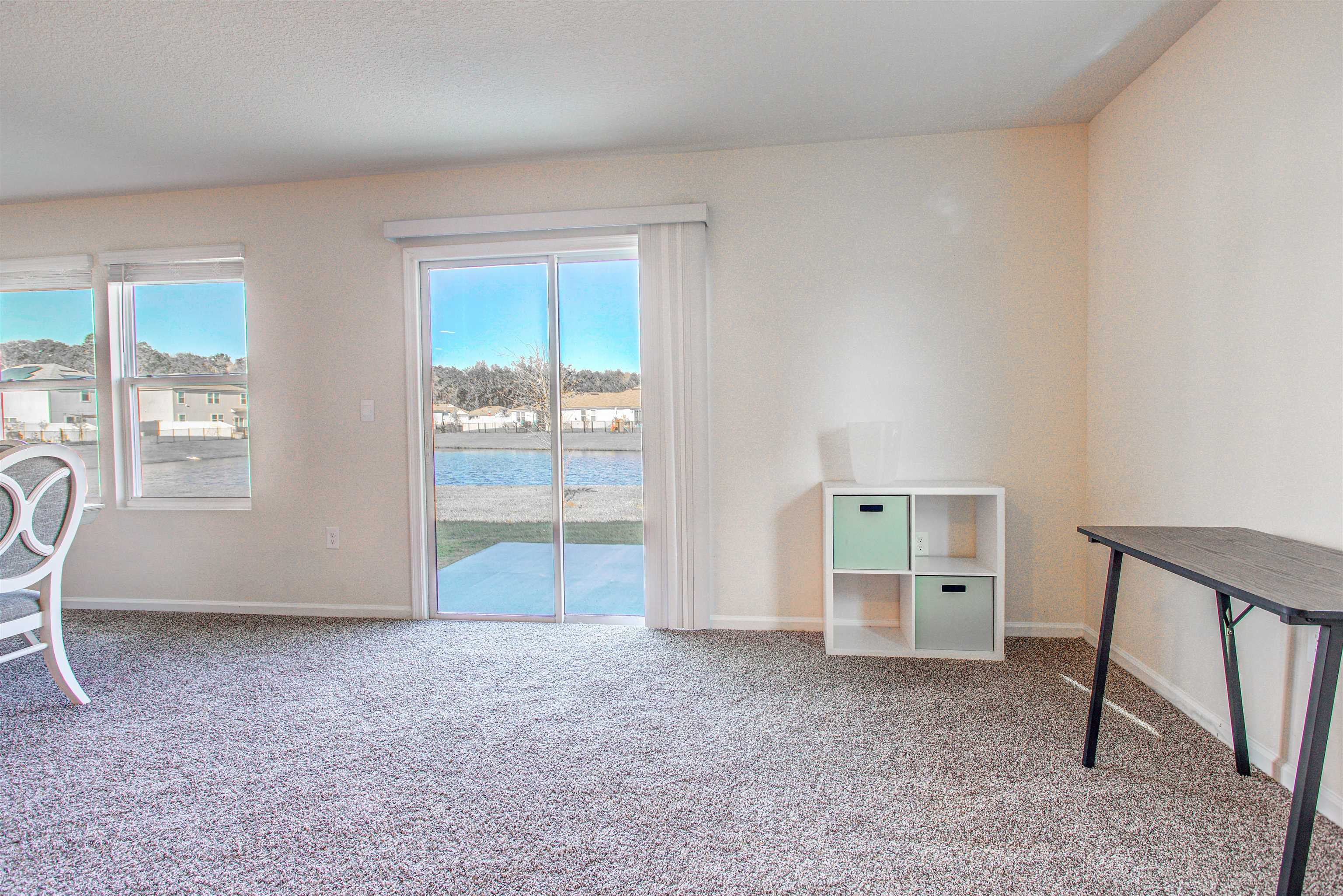 108 Albacete Road St. Augustine, FL 32084 - Photo 13 of 37 a view of an empty room with a window