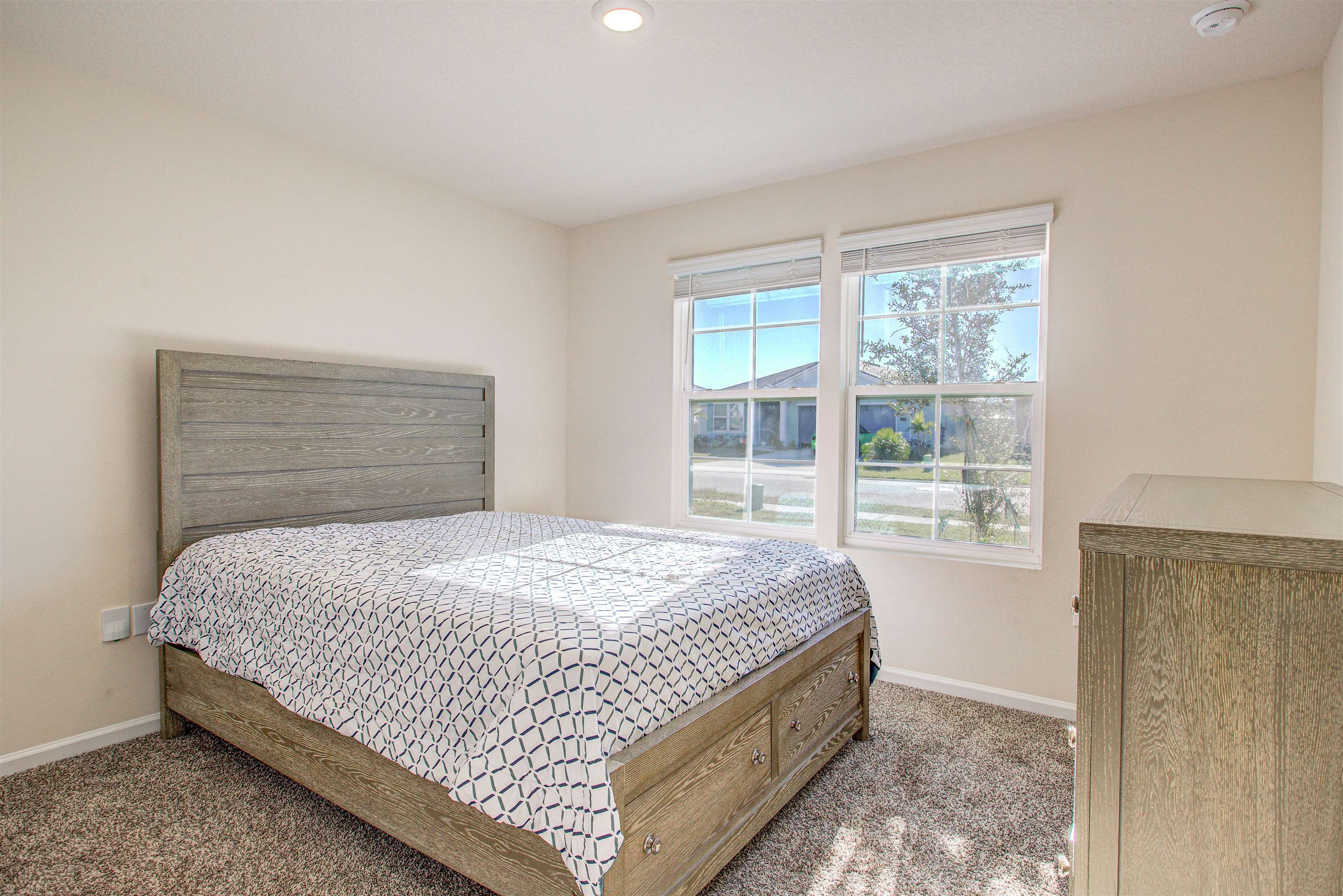 108 Albacete Road St. Augustine, FL 32084 - Photo 14 of 37 a bedroom with a bed and a window