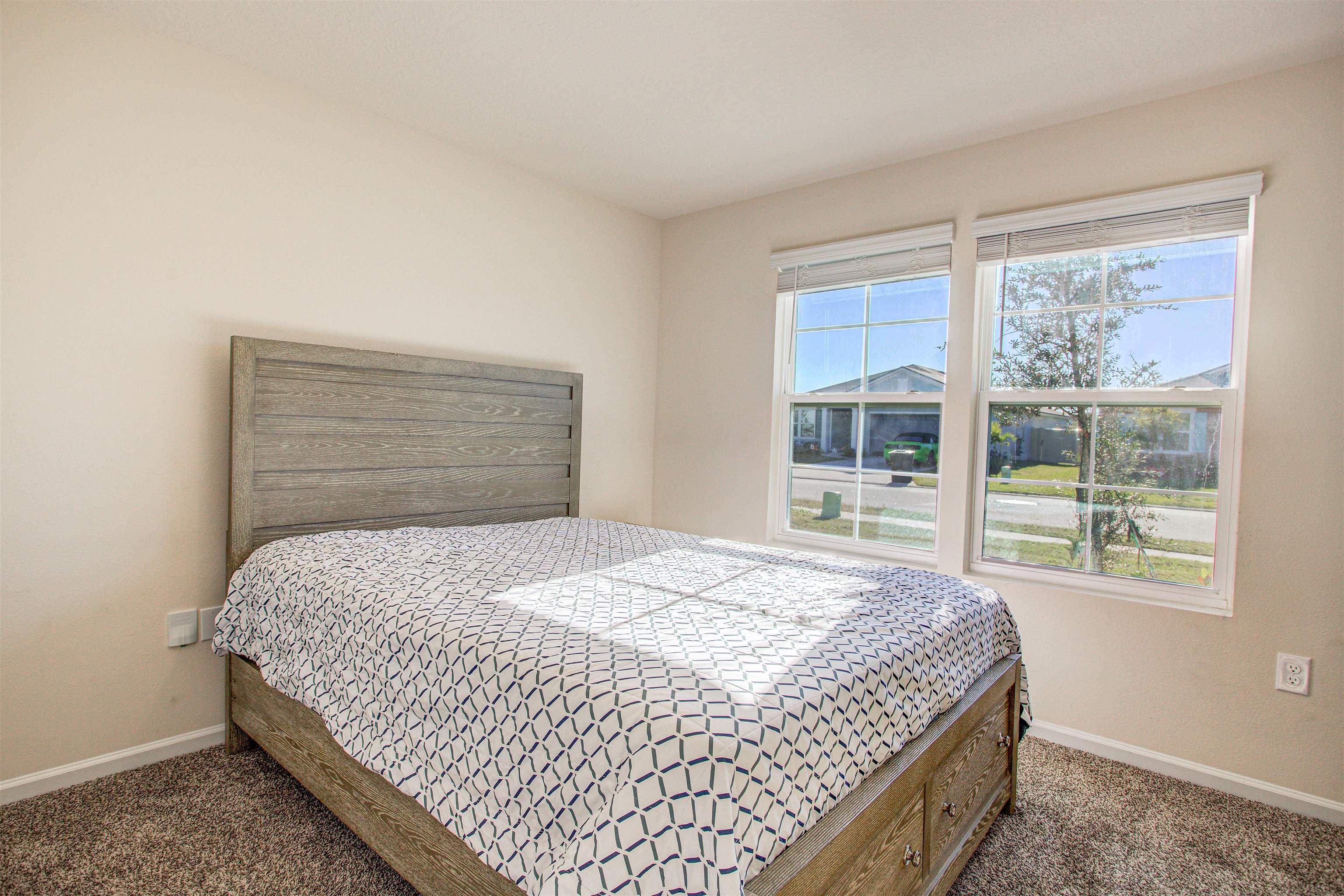108 Albacete Road St. Augustine, FL 32084 - Photo 15 of 37 a bedroom with a bed and a window