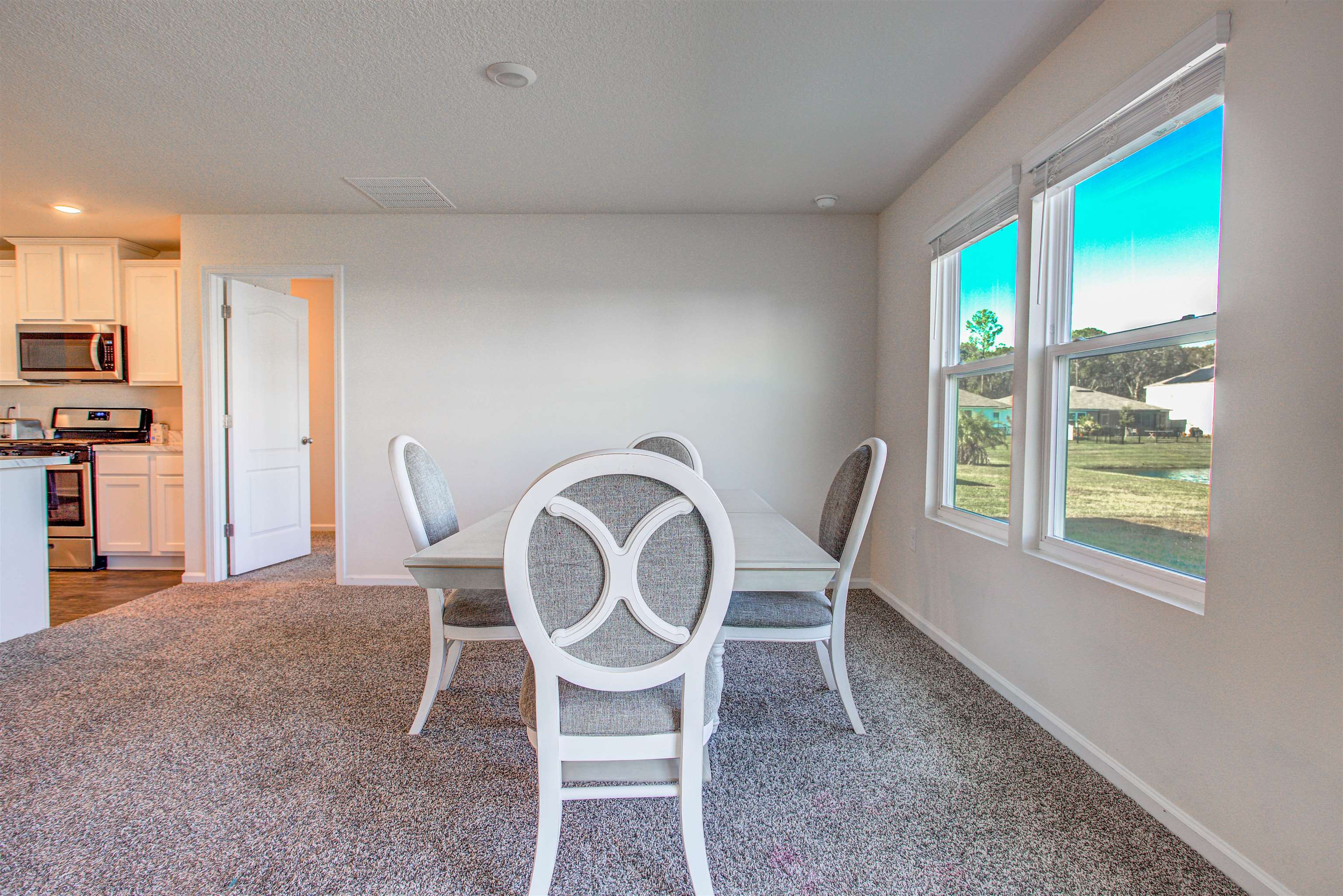 108 Albacete Road St. Augustine, FL 32084 - Photo 19 of 37 a dining room with furniture and window