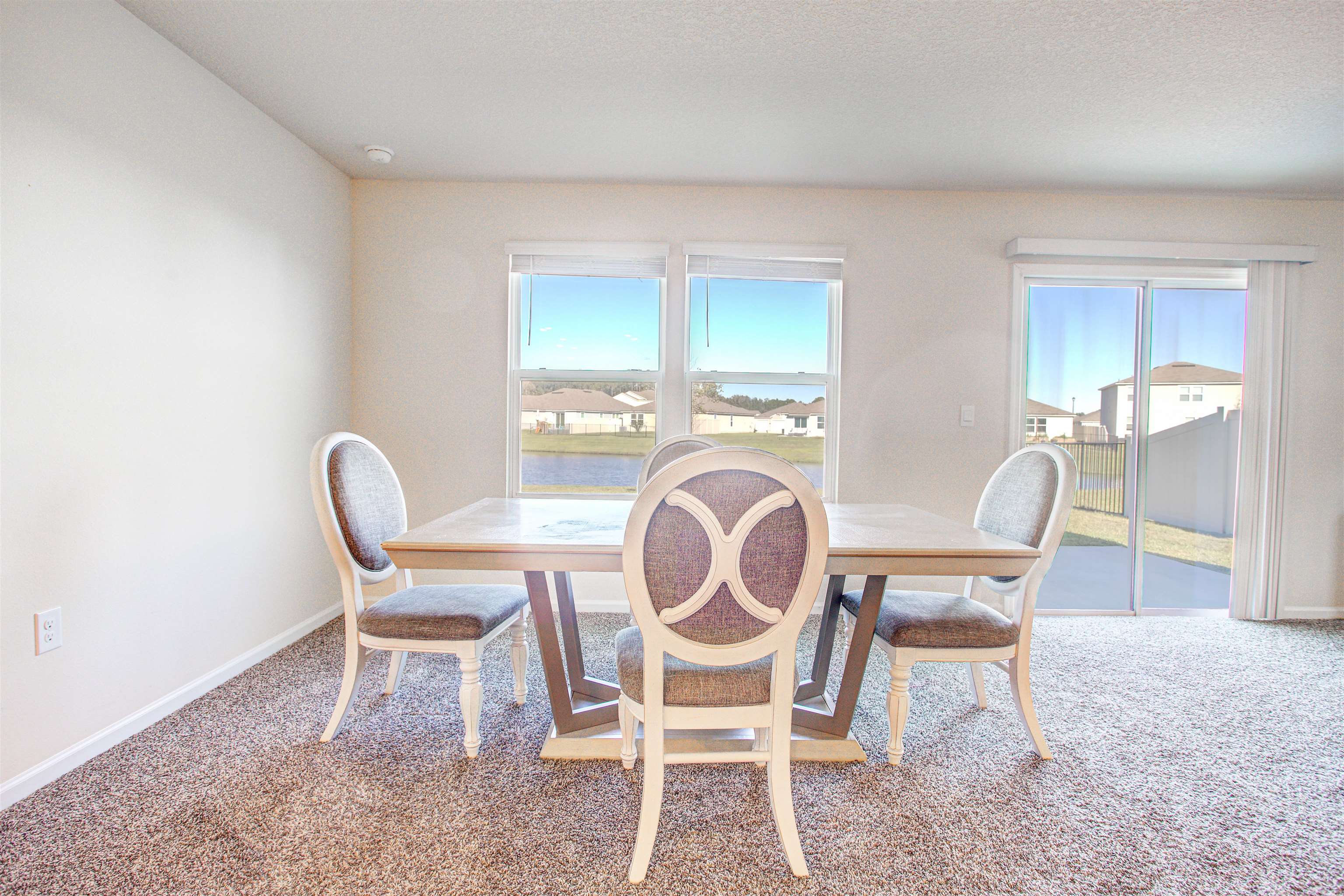 108 Albacete Road St. Augustine, FL 32084 - Photo 20 of 37 a dining room with furniture and window