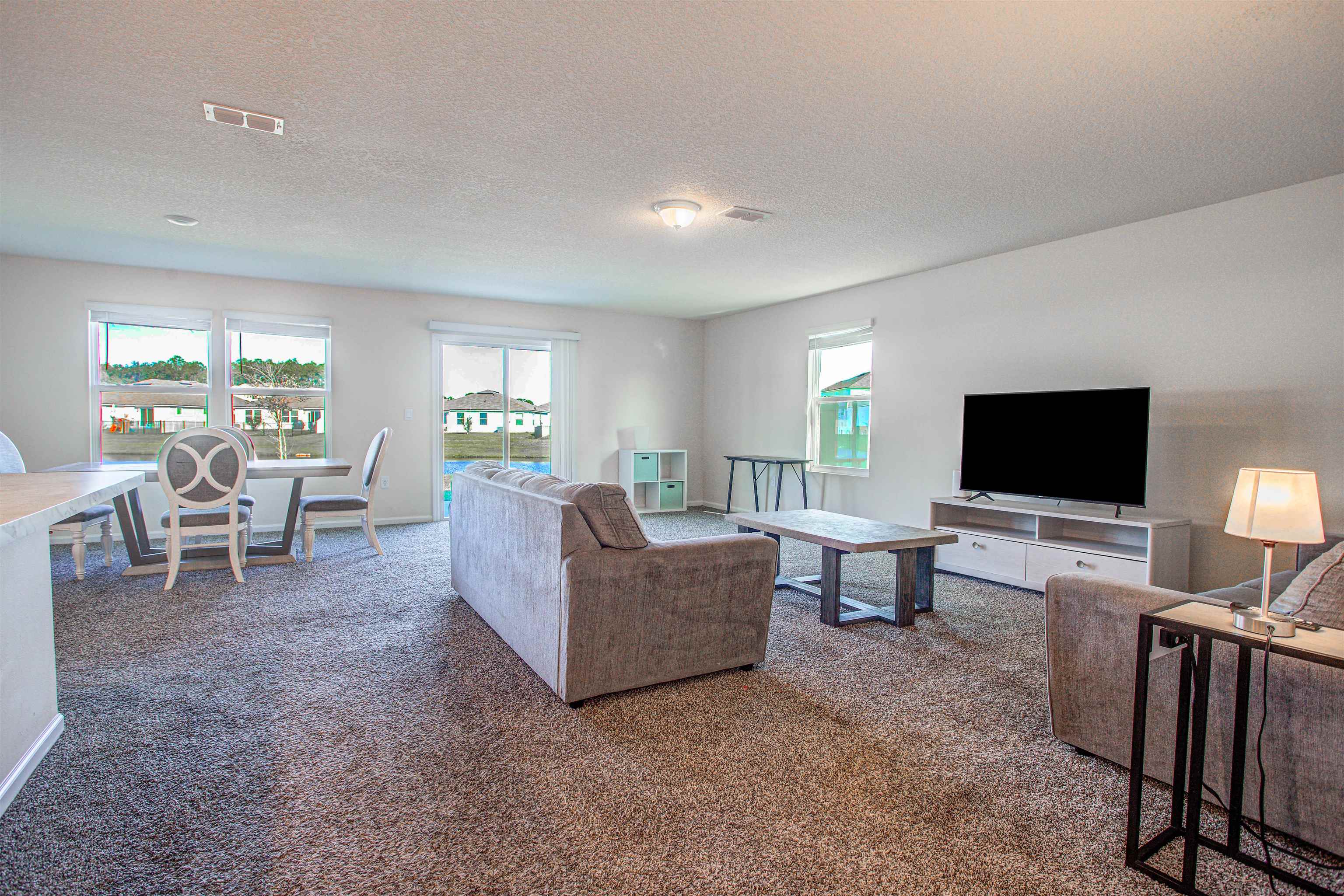 108 Albacete Road St. Augustine, FL 32084 - Photo 3 of 37 a living room with furniture and a flat screen tv