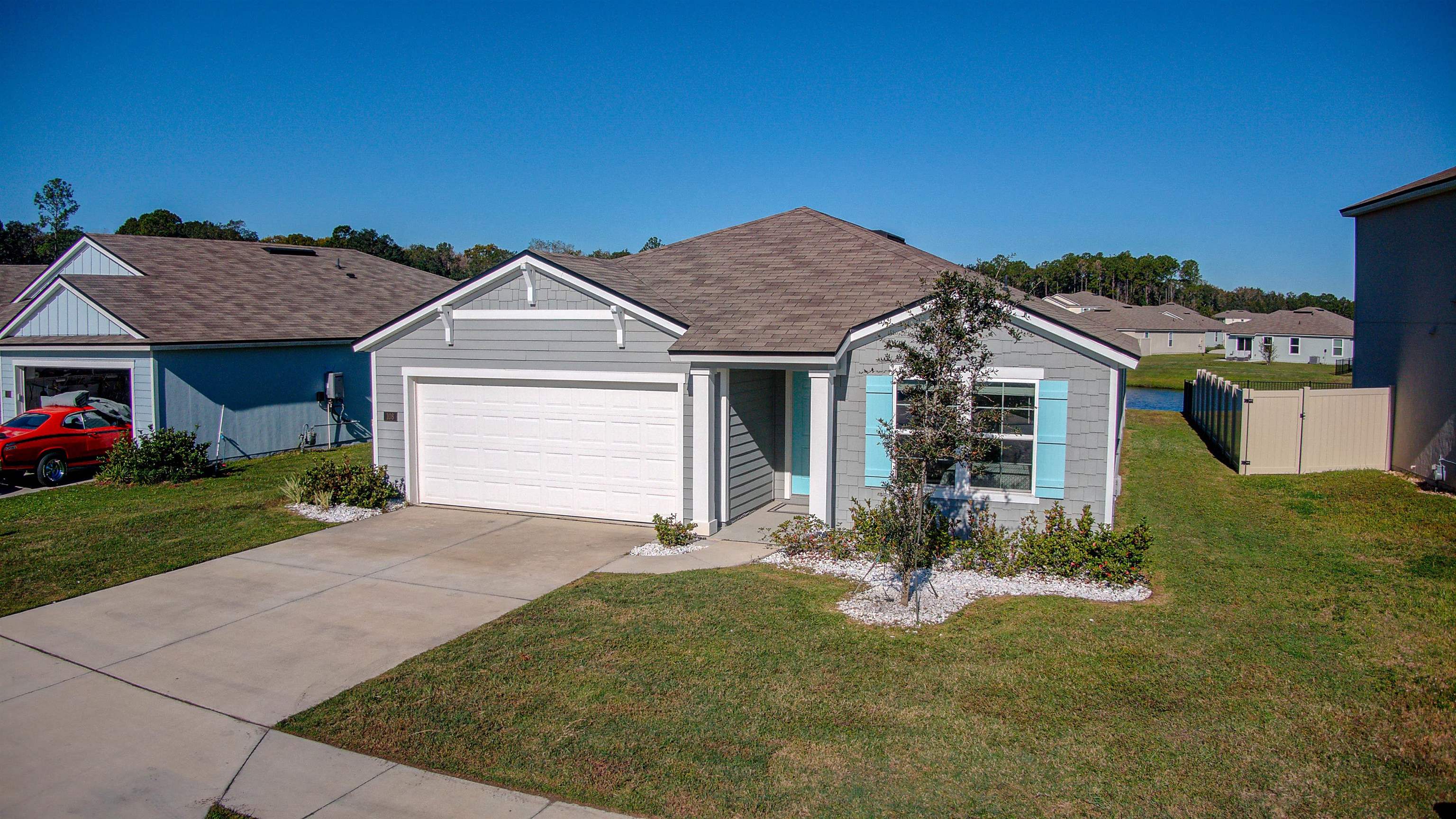 108 Albacete Road St. Augustine, FL 32084 - Photo 35 of 37 a front view of a house with a yard and garage
