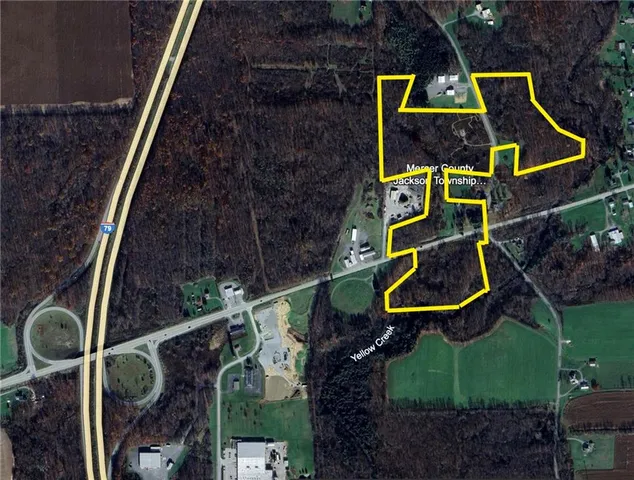 an aerial view of house with swimming pool