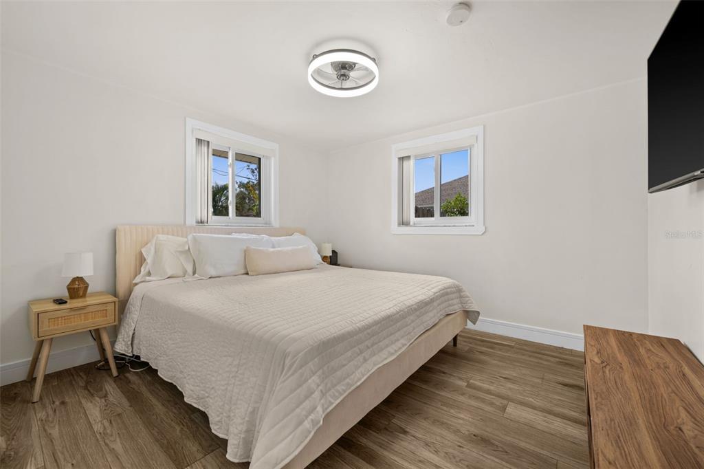 219 Coral Road Venice, FL 34293 - Photo 14 of 24 a bed room with a bed and a tv